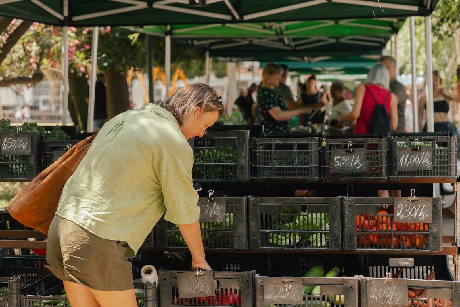 Middle-aged woman shopping at the Dane County Farmers Market This Spring